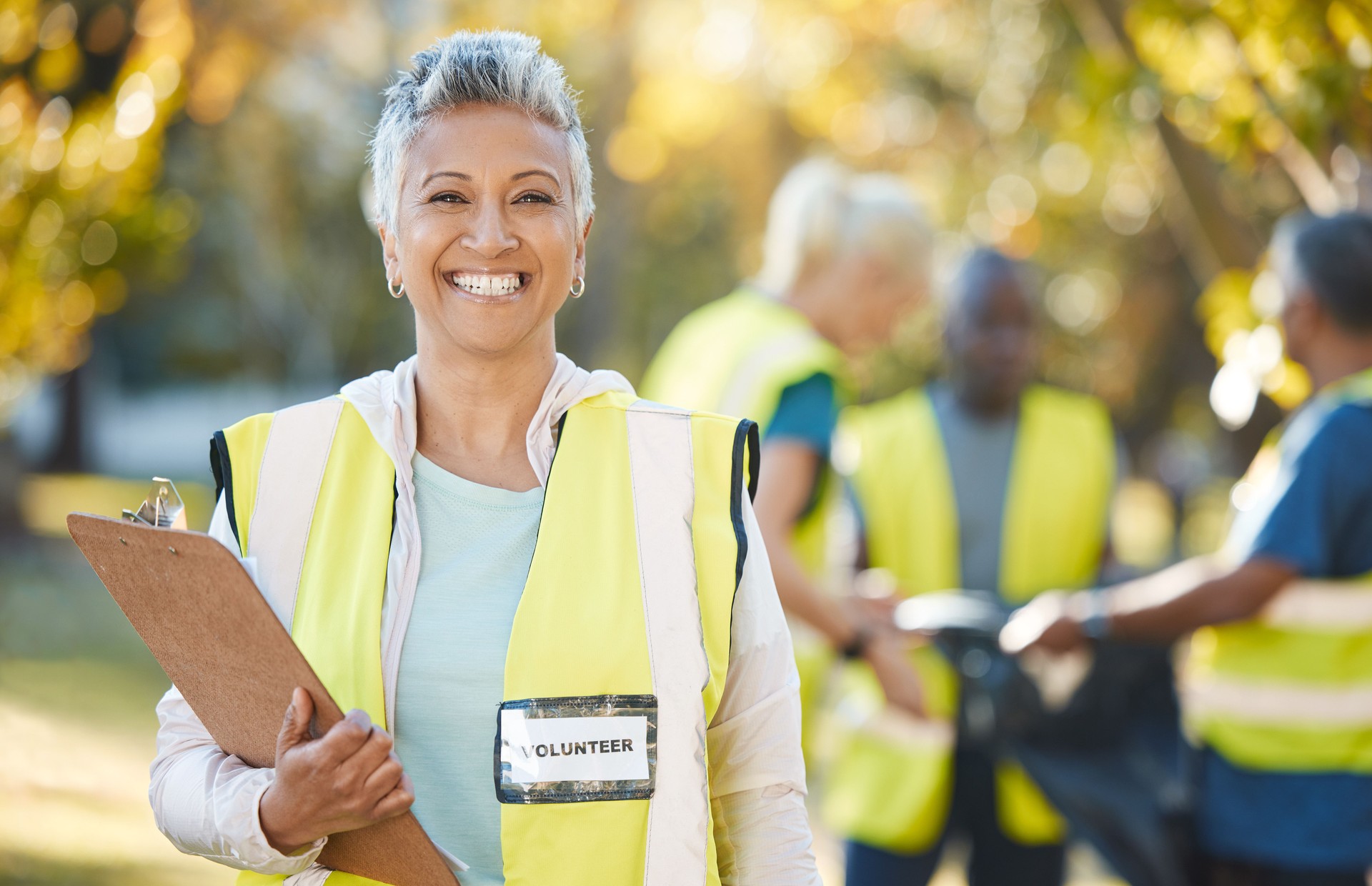 Clipboard, volunteering portrait and woman in park cleaning, community service and pollution or waste checklist. Pollution, inspection and senior person or manager in ngo or nonprofit project outdoor
