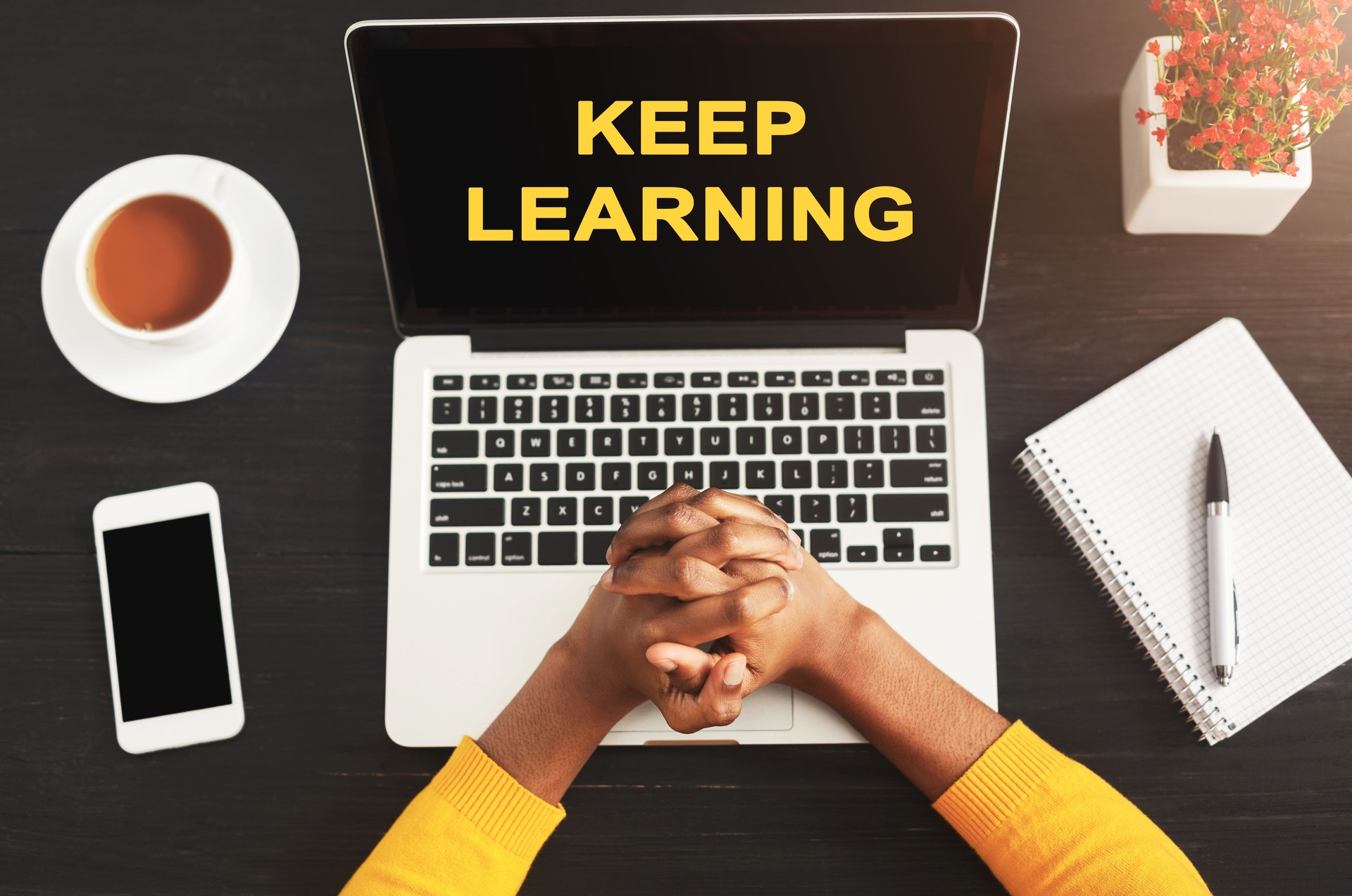Keep Learning Text On Laptop Screen Standing On Student's Table